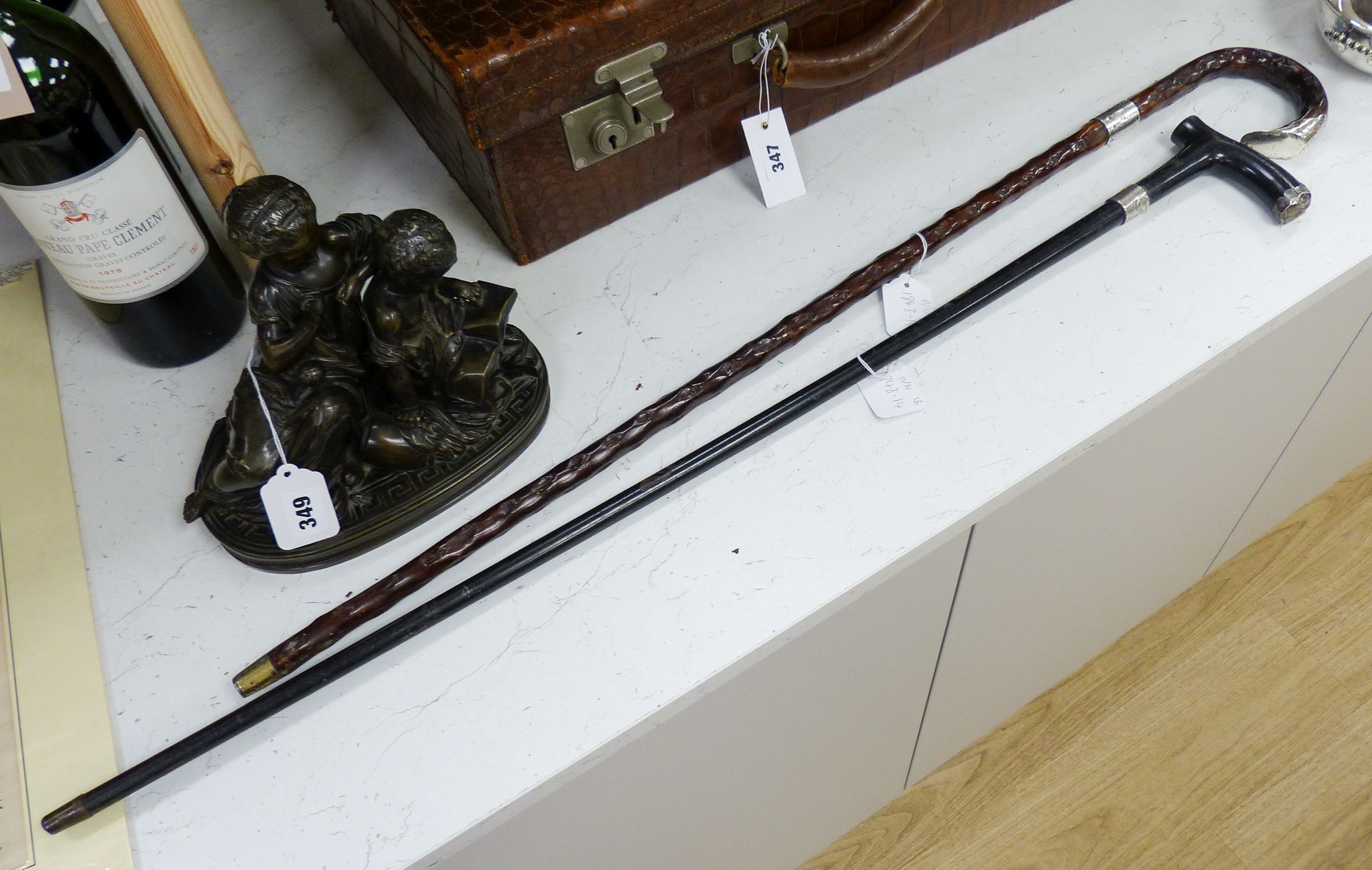 Two Victorian silver mounted walking sticks, longest 92.5 cm